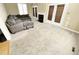 Spacious living room with fireplace, carpet, and French doors at 5718 Sentinel Dr, Raleigh, NC 27609