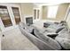 Living room features a large sectional sofa and fireplace at 5718 Sentinel Dr, Raleigh, NC 27609