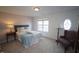 Bright bedroom with neutral walls and window seat at 5744 Corbon Crest Ln, Raleigh, NC 27612