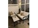 Cozy patio furniture with a small table and pillows at 5744 Corbon Crest Ln, Raleigh, NC 27612