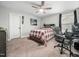 Spacious bedroom with a plaid bedspread and built-in drawers at 605 Richlands Cliff Dr, Youngsville, NC 27596