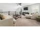 Spacious loft area with comfortable seating and TV at 605 Richlands Cliff Dr, Youngsville, NC 27596