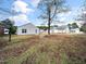 Large backyard with fire pit and plenty of green space at 801 Thornberry Ct, Spring Hope, NC 27882