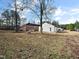 Spacious backyard with fire pit and view of neighboring home at 801 Thornberry Ct, Spring Hope, NC 27882