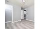 Spacious bedroom with wood-look floors and ample closet space at 801 Thornberry Ct, Spring Hope, NC 27882
