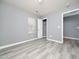 Bright bedroom featuring wood-look floors and a sizable closet at 801 Thornberry Ct, Spring Hope, NC 27882
