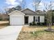 Cute one-story house with attached garage and landscaped yard at 801 Thornberry Ct, Spring Hope, NC 27882