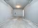 Unfinished garage with concrete floor and ample storage at 801 Thornberry Ct, Spring Hope, NC 27882