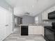 Modern kitchen with granite countertops and white cabinets at 801 Thornberry Ct, Spring Hope, NC 27882