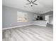 Spacious living room with gray walls and vinyl plank flooring at 801 Thornberry Ct, Spring Hope, NC 27882