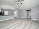 Open concept living room and kitchen with gray walls at 801 Thornberry Ct, Spring Hope, NC 27882