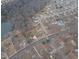 Aerial view showing home's location, neighborhood, and proximity to a lake at 802 S Sellars Mill Rd, Burlington, NC 27217