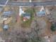 Aerial view showing the home's backyard, patio, and surrounding landscape at 802 S Sellars Mill Rd, Burlington, NC 27217