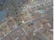 Aerial view shows home's location near a lake and quiet neighborhood at 802 S Sellars Mill Rd, Burlington, NC 27217