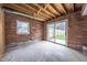 Finished basement room with sliding glass door leading to backyard at 802 S Sellars Mill Rd, Burlington, NC 27217