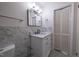 Updated bathroom features a white vanity, marble tile, and a spacious shower at 802 S Sellars Mill Rd, Burlington, NC 27217