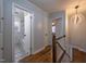 View of updated bathroom with marble tile flooring at 802 S Sellars Mill Rd, Burlington, NC 27217