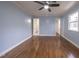 Bedroom with hardwood floors and access to bathroom and closet at 802 S Sellars Mill Rd, Burlington, NC 27217