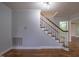 Hardwood floors and a staircase are featured in this light-filled entryway at 802 S Sellars Mill Rd, Burlington, NC 27217