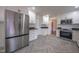 Modern kitchen with stainless steel appliances and granite countertops at 802 S Sellars Mill Rd, Burlington, NC 27217
