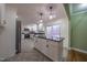 Modern kitchen with island, granite countertops, and stainless steel appliances at 802 S Sellars Mill Rd, Burlington, NC 27217