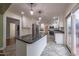 Modern kitchen with island, granite countertops, and stainless steel appliances at 802 S Sellars Mill Rd, Burlington, NC 27217