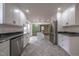 Modern kitchen with island, granite countertops, and stainless steel appliances at 802 S Sellars Mill Rd, Burlington, NC 27217