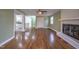Hardwood floor living room, fireplace, and view into kitchen at 802 S Sellars Mill Rd, Burlington, NC 27217