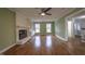 Spacious living room with hardwood floors, built-in shelving, and a fireplace at 802 S Sellars Mill Rd, Burlington, NC 27217