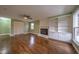 Spacious living room with hardwood floors, fireplace, and built-in shelving at 802 S Sellars Mill Rd, Burlington, NC 27217