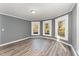 Spacious living room featuring hardwood floors and large windows at 805 N Mebane St, Burlington, NC 27217