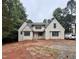 Charming new construction home featuring brick exterior, multiple windows, and a covered front porch at 8604 Windjammer Dr, Raleigh, NC 27615