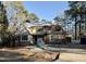 New construction home featuring a brick and siding facade, surrounded by scaffolding and construction materials at 8604 Windjammer Dr, Raleigh, NC 27615