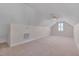 Bright bonus room featuring a ceiling fan and window with plantation shutters at 1024 Bellenden Dr, Durham, NC 27713