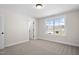 Spacious bedroom with window, door to en-suite bathroom, and neutral wall colors at 1035 Gibson House Dr, Burlington, NC 27215