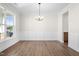 Dining room with hardwood floors, wainscoting, and a chandelier at 1035 Gibson House Dr, Burlington, NC 27215