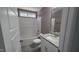 Bathroom featuring tub-shower combo, granite counters and ample room providing a practical space at 121 Tanglewood Dr # 8-J, Louisburg, NC 27549