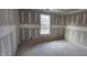 Unfinished bedroom with window and wood flooring at 121 Tanglewood Dr # 8-J, Louisburg, NC 27549