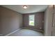 Bedroom with carpet, window, and neutral colored walls at 121 Tanglewood Dr # 8-J, Louisburg, NC 27549