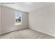 Illustration of a bedroom showcasing a light filled window and neutral carpeting at 121 Tanglewood Dr # 8-J, Louisburg, NC 27549