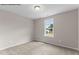 This bedroom features a picture window to let natural light into the space at 121 Tanglewood Dr # 8-J, Louisburg, NC 27549