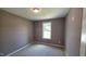 Bedroom featuring neutral carpet and a window providing natural light to the calming colored walls at 121 Tanglewood Dr # 8-J, Louisburg, NC 27549