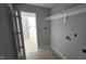 Walk-in closet with utility hookups and shelving, offering practical storage solutions and possibilities at 121 Tanglewood Dr # 8-J, Louisburg, NC 27549