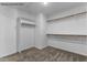 Walk-in closet with shelving, neutral carpet, and white walls at 121 Tanglewood Dr # 8-J, Louisburg, NC 27549