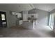 Bright and spacious kitchen with white cabinets and a center island, ready for appliances at 121 Tanglewood Dr # 8-J, Louisburg, NC 27549