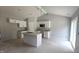 New construction kitchen featuring white cabinets, granite countertops, kitchen island, and stainless appliances at 121 Tanglewood Dr # 8-J, Louisburg, NC 27549