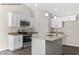 Modern kitchen with white cabinets, granite counters, and an island at 121 Tanglewood Dr # 8-J, Louisburg, NC 27549
