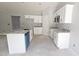 New construction kitchen featuring white cabinetry, granite countertops, stainless appliances, and a kitchen island at 121 Tanglewood Dr # 8-J, Louisburg, NC 27549