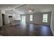 Open floor plan featuring a living room and modern kitchen at 121 Tanglewood Dr # 8-J, Louisburg, NC 27549