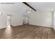Spacious living area with vaulted ceiling, modern flooring, and a neutral color scheme at 121 Tanglewood Dr # 8-J, Louisburg, NC 27549